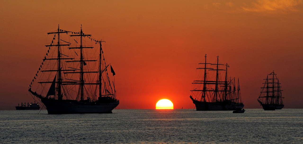 Tall ships at sunset